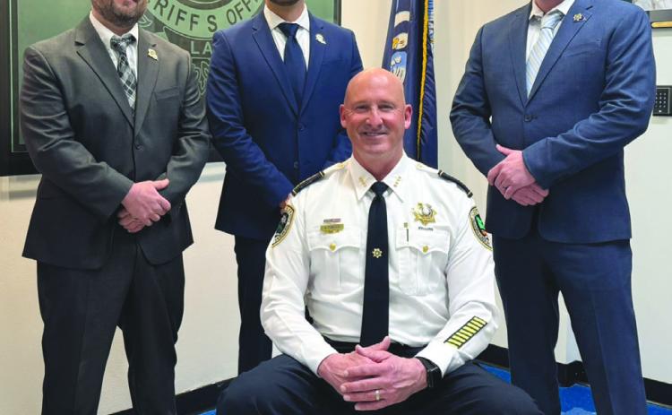 From left (standing): Lt. Jason Kornovich, Lt. John McDaniel, Captain Paul Durnin. (Seated): Sheri Jerry Turlich.