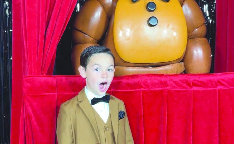 Logan is joined at the Hollywood premiere with Freddy Fazbear, an animatronic from the film.