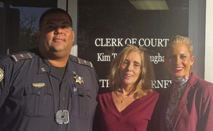 From left: Lt. Rogers Landry Jr., victim Kimberly Daniel and Asst. District Attorney Sarah Ansardi Tesvich