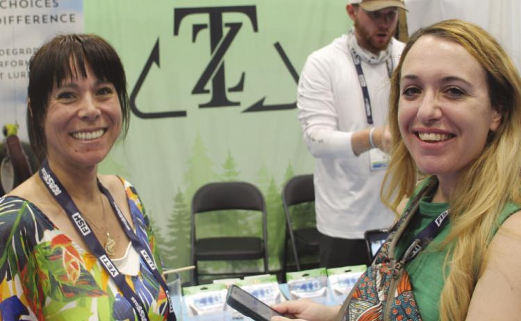 Visting the Zero Trace booth, pictured: Andrea (left), Evan (back) and Gabriella (right).