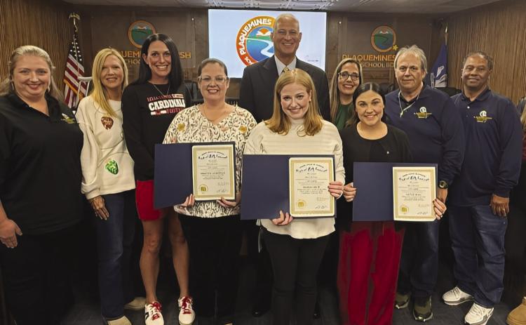 School board members, superintendent Shelley Ritz, and Governor Landry representative Austin Badon present teachers Hannah Smith of Belle Chasse Elementary School, Kaylee Boaz of Belle Chasse Middle School, and Christina Lauricella of Belle Chasse High School with proclamations from Governor Landry recognizing them for being named teachers of the year within the school system.