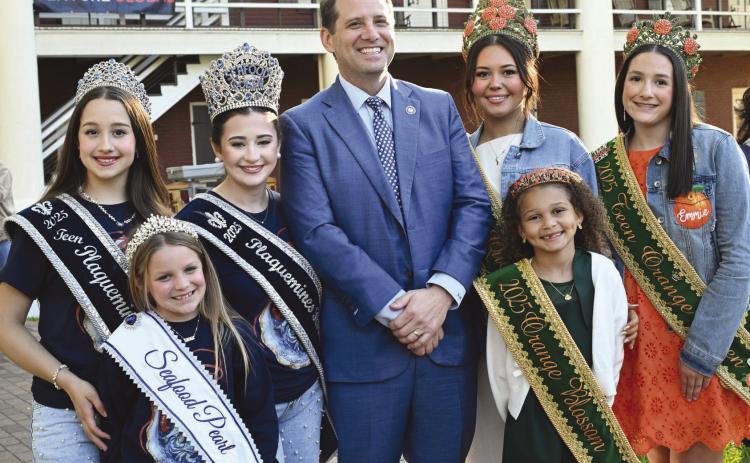 Plaquemines Parish Day was held at the state capitol on March 18, 2026. The annual event allows local o cials to highlight what the parish has to o er including food and music. Pictured from left: 2025 Seafood Festival Teen Queen Brynly Newby, Pearl Demi Panepinto, Queen Kadence Johnson, State Rep. Jacob Braud, 2025 Orange Queen Kristin Hannah Nash, Orange Blossom Mia Nicole Brown, and Teen Queen Emmie Faith Gondrella.