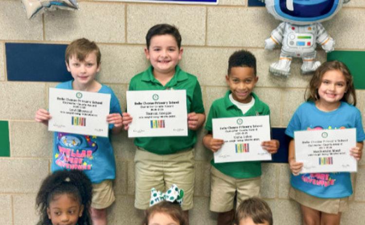 (Left to Right) First Grade: Levi Silkwood, Thomas Keegan, Kyrie Sylve, Mackenzie West, Brianna Philson, Audrey Vodopija, and Gionni Isemann.