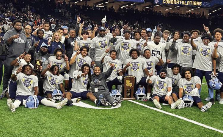 Above: SPHS Football team and staff poses for a photo after their state championship win. With this win, Head Coach Lyle Fitte secured his 3rd state title with the South Plaquemines football program as he w as a player on the 2007 and 2008 teams that won state championships.