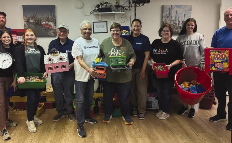 One of the Kiwanis service projects involved members helping clean and tidy the Plaquemines Community C.A.R.E. Center.